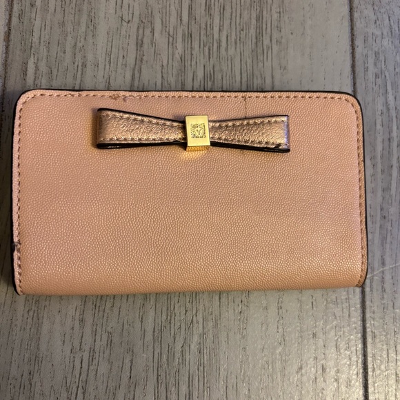 Anne Klein Handbags - Anne Klein Peach Pink & Gold Bow Accent Cellphone Wallet